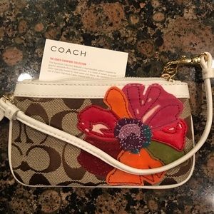 Coach wristlet with poppy flower